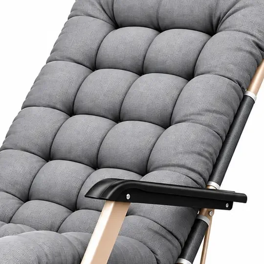 Close-up of the thick tufted grey cushion